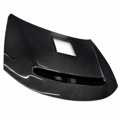 Carbon fiber Demon Window hood, top angled view showing the vent ring and the rectangular clear window