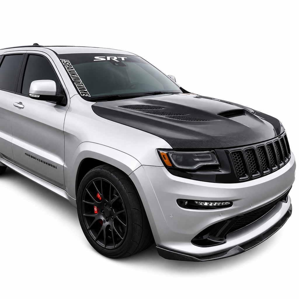 Silver Jeep Grand Cherokee SRT front three quarter view with a carbon Sniper hood and SRT windscreen banner
