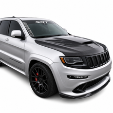 Load image into Gallery viewer, Silver Jeep Grand Cherokee SRT front three quarter view with a carbon Sniper hood and SRT windscreen banner