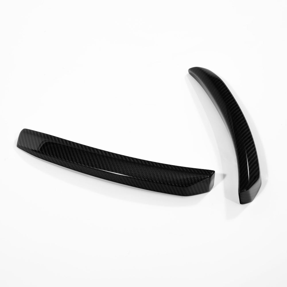 Side profile of a Huracan STO carbon fiber wind deflector upright showing the tapered leading edge