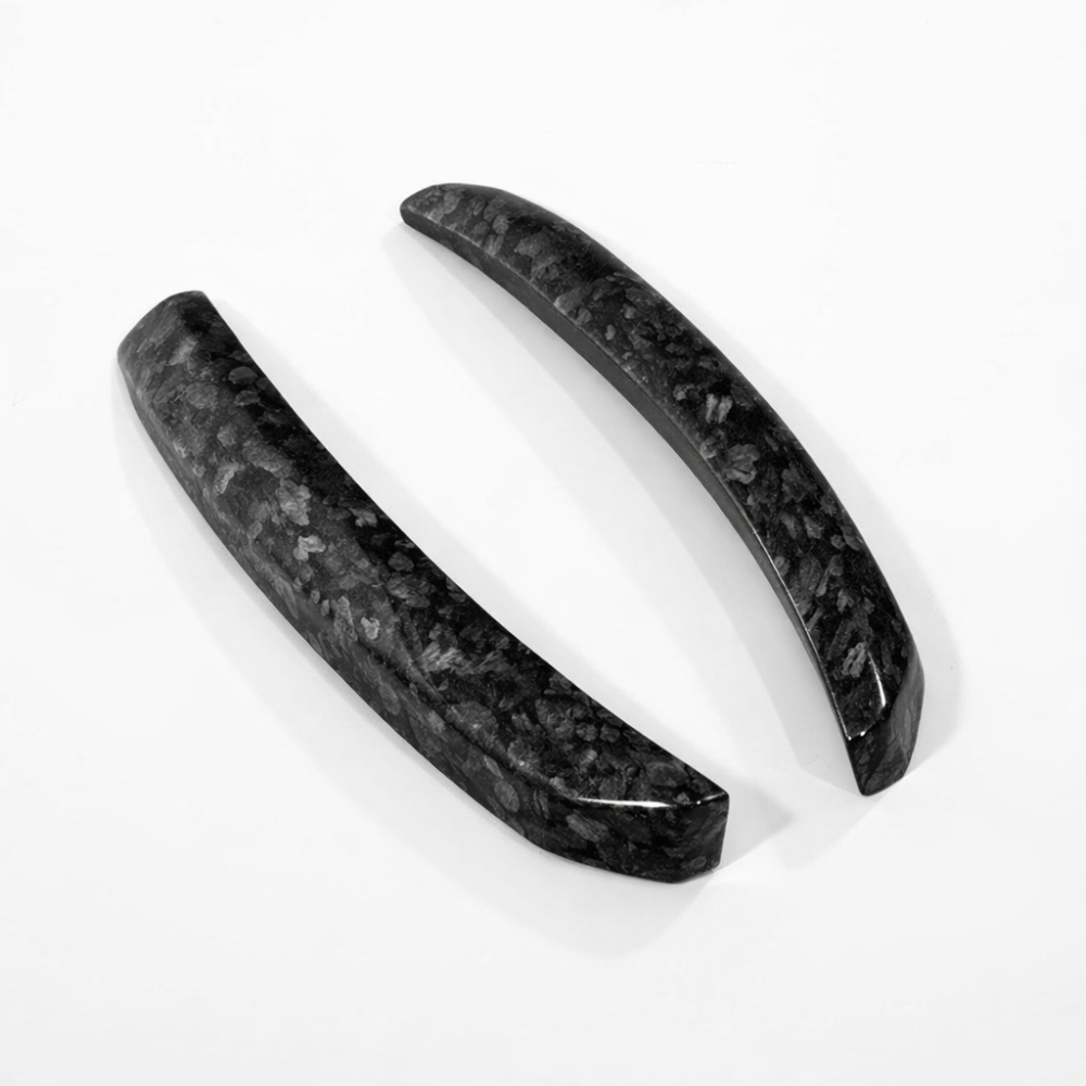 Pair of Huracan STO wind deflector uprights in forged carbon showing the marbled non directional pattern