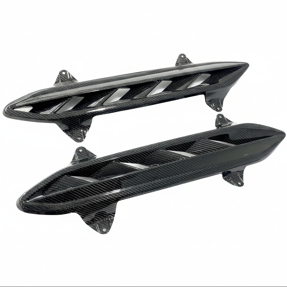 Isolated pair of Black Ops Auto Works carbon fiber hood vents for Lamborghini Urus S and Performante, angled studio shot