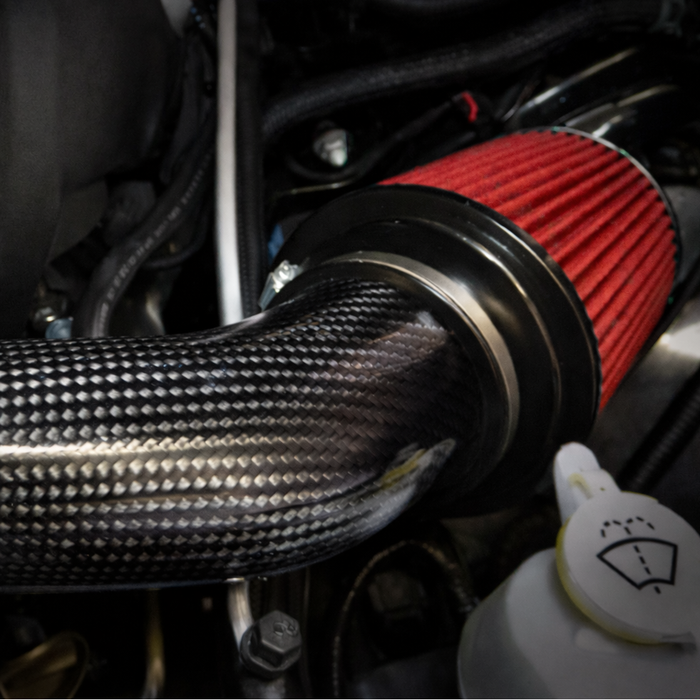 LegMaker carbon fiber short ram intake installed in Jeep Grand Cherokee SRT engine bay