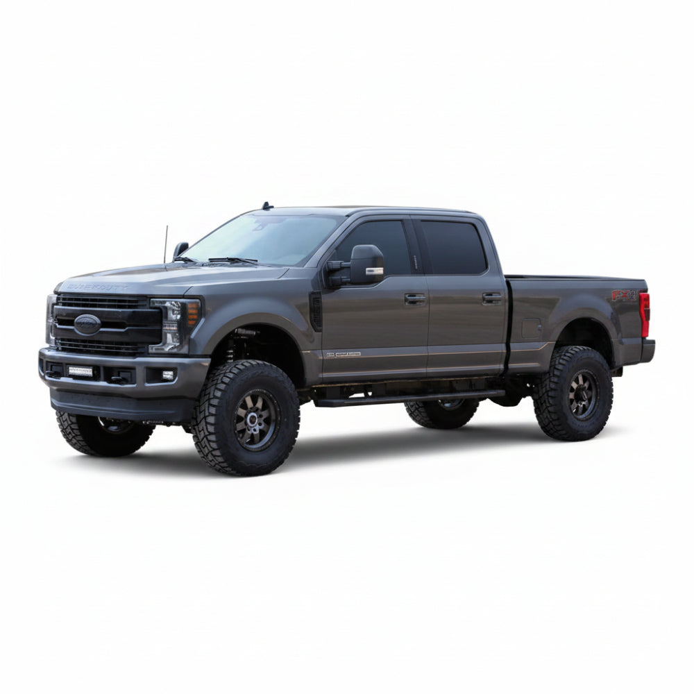 Lifted gray Ford Super Duty crew cab shown from the front side