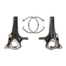 Load image into Gallery viewer, Pair of MaxTrac four inch lift spindles for the Ram 1500 two wheel drive shown with the two extended DOT brake lines on a white background