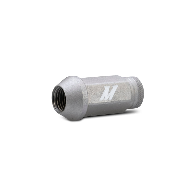 Close-up of Mishimoto silver lug nut showing M logo