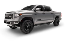 Load image into Gallery viewer, Silver crew cab pickup with N-Fab nerf steps installed, front three-quarter view