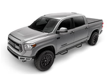 Load image into Gallery viewer, Silver crew cab pickup with N-Fab nerf steps installed, rear three-quarter view