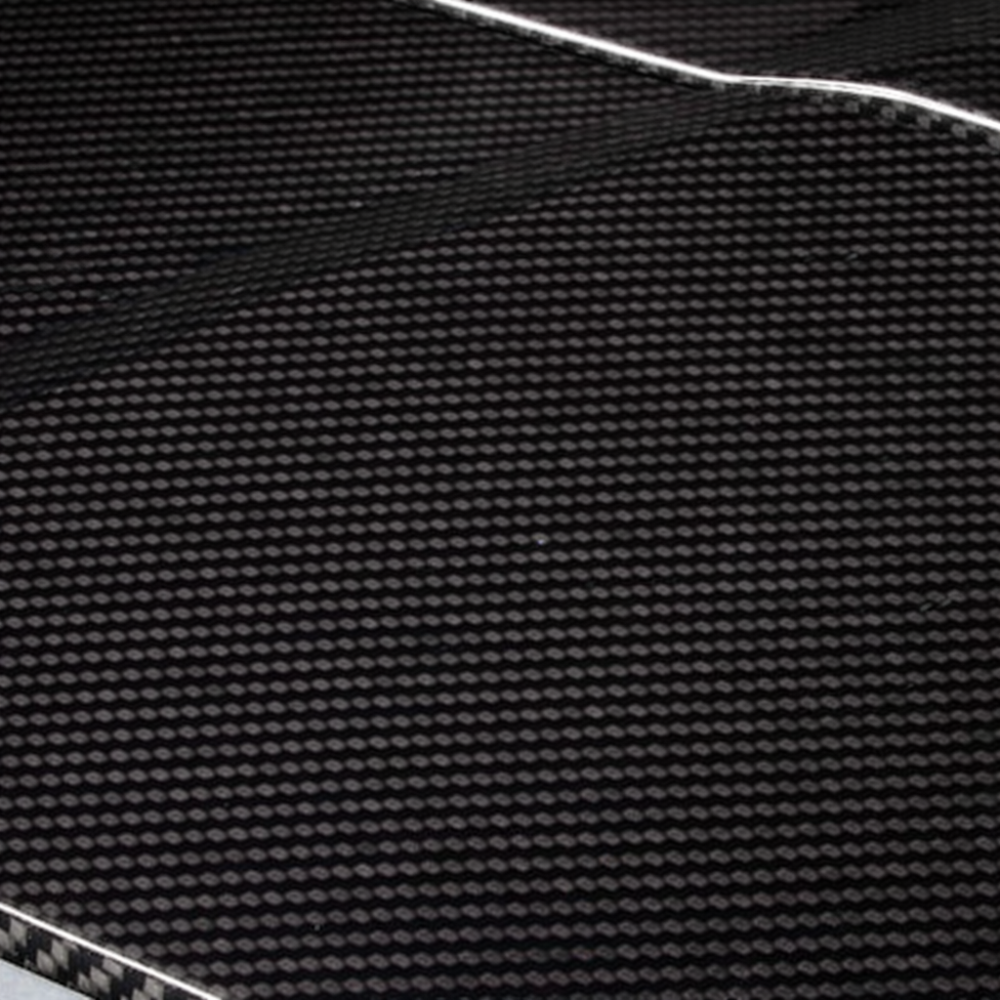 Close-up of genuine 3K carbon fiber twill and UV clear coat