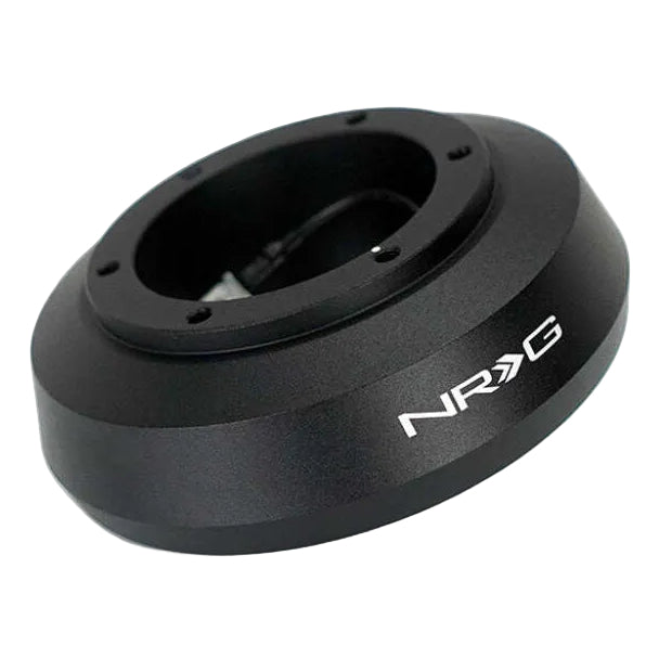 Black anodized NRG SRK-124H short hub adapter at an angle showing the bolt holes on the wheel mounting face