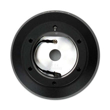 Load image into Gallery viewer, Front face of the NRG SRK-124H short hub adapter with six mounting holes around a polished horn contact plate