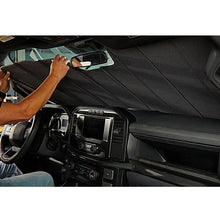 Load image into Gallery viewer, Covercraft UVS100 Tundra sunscreen installed under windshield of 22-26 Toyota Tundra during installation