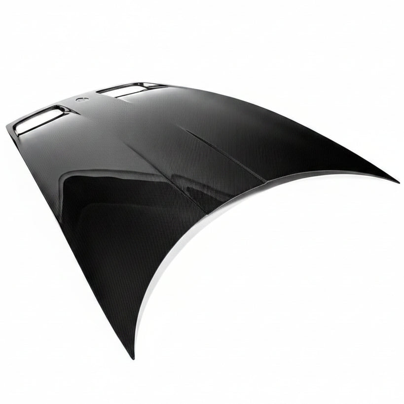 Porsche 992 GT3 carbon fiber hood viewed from the rear three quarter, showing the raised centre contour
