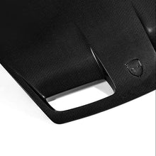 Load image into Gallery viewer, Porsche 992 GT3 carbon fiber hood top view showing the twill weave surface and Porsche crest decal
