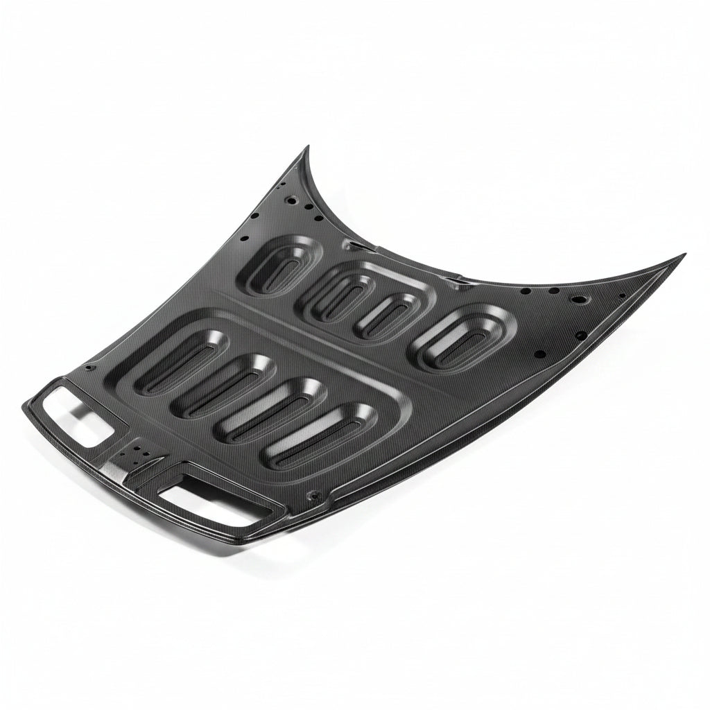 Porsche 992 GT3 carbon fiber hood underside showing the moulded reinforcement rib grid and mounting holes