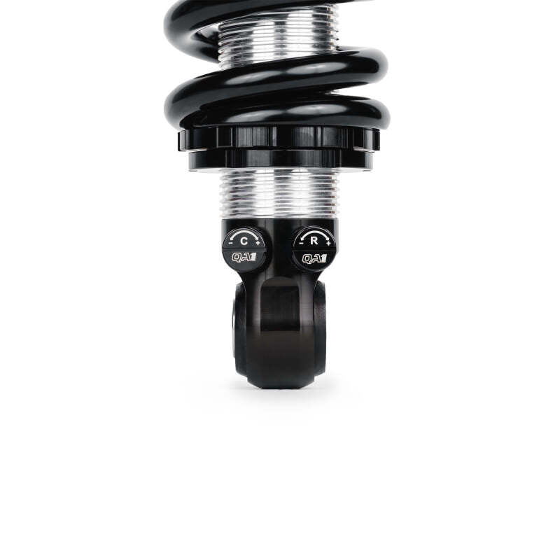 Close-up of QA1 coilover shock threaded body and dual adjustment knobs for compression and rebound on 99-06 Chevy Silverado 1500 2WD front suspension kit.