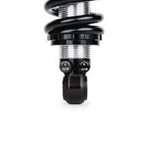 Load image into Gallery viewer, Close-up of QA1 coilover shock threaded body and dual adjustment knobs for compression and rebound on 99-06 Chevy Silverado 1500 2WD front suspension kit.