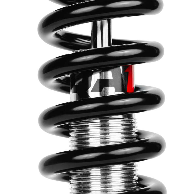 Close-up of QA1 99-06 Chevy Silverado 1500 2WD single adjustable front suspension coilover spring with QA1 logo