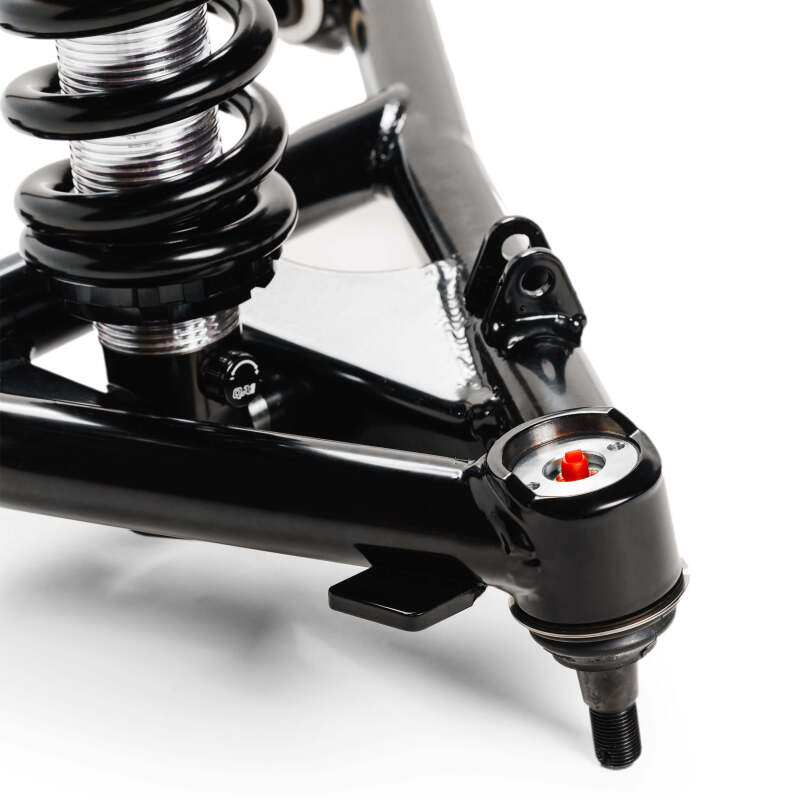 Close-up side view of QA1 99-06 Chevy Silverado 1500 2WD single adjustable front suspension assembly showing coilover spring, control arm, and shock mount