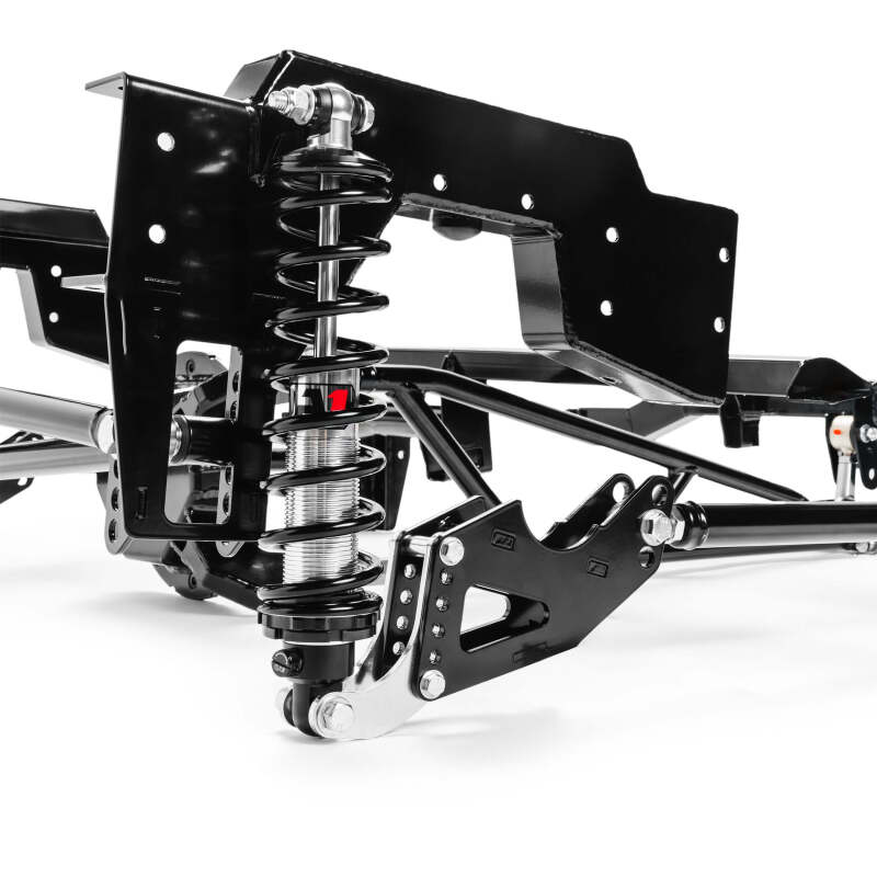 Close-up view of QA1 single adjustable coil-over shock and bracket in the rear suspension kit for 1999-2006 Chevy Silverado 1500 short bed