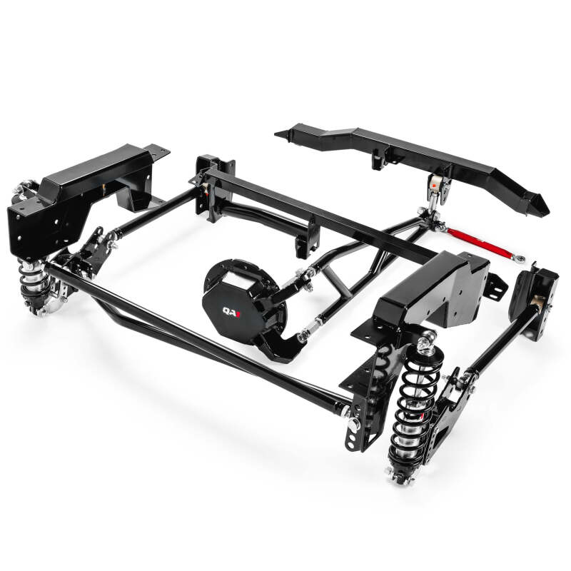 Out-of-package view of QA1 single adjustable rear suspension kit components including coil-over shocks, torque arm, trailing arms, crossmember, and panhard bar for 1999-2006 Chevy Silverado 1500 short bed