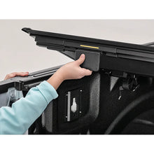Load image into Gallery viewer, BAKFlip MX4 tonneau cover folded open for full bed access on a Ram 1500