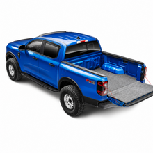 Load image into Gallery viewer, Husky Liners Guardian Impact bed mat installed in 2019-2025 Ram 1500 Crew Cab for heavy-duty truck bed protection