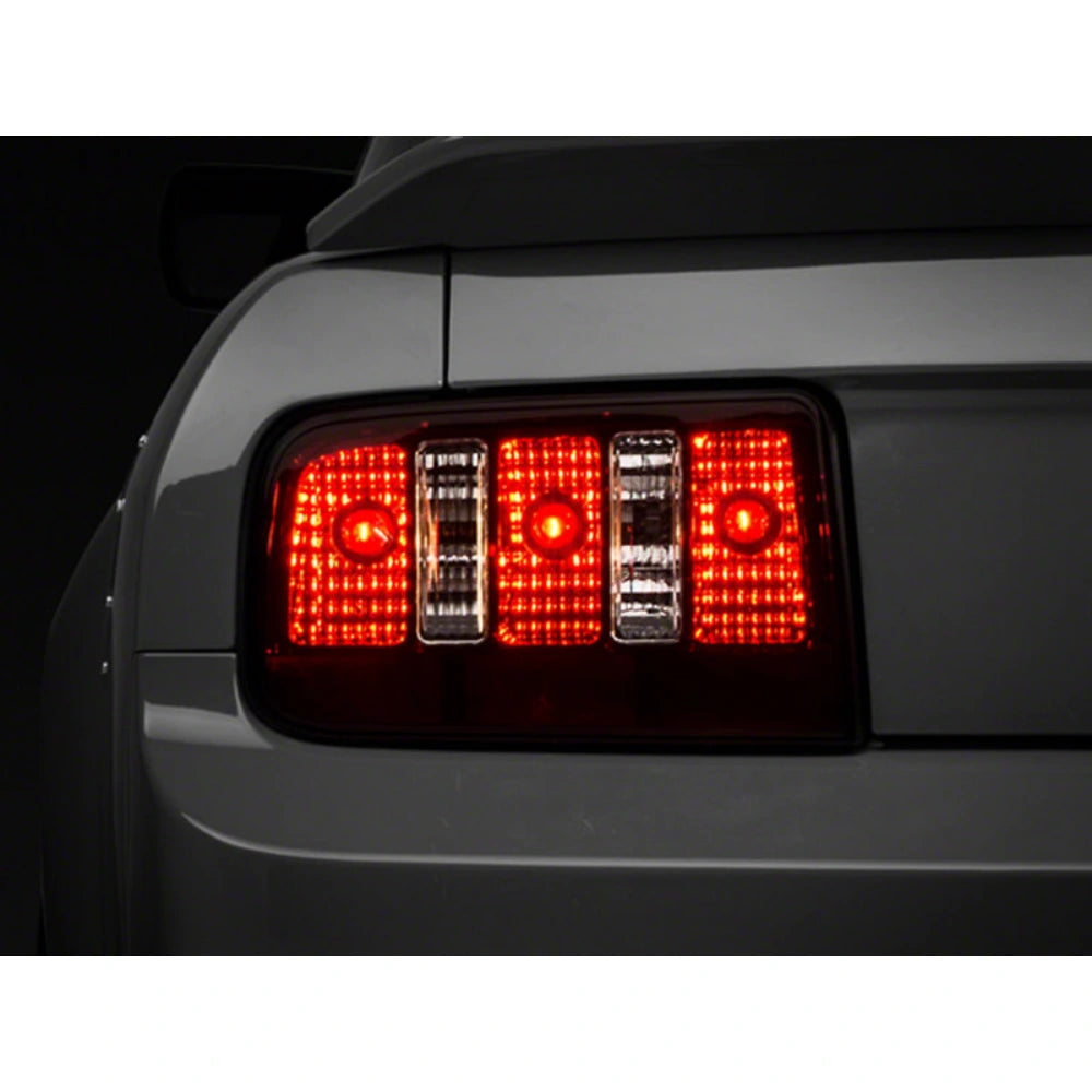 Raxiom 05-09 Ford Mustang Coyote Tail Lights- Black Housing (Smoked Lens) - Raxiom 49117