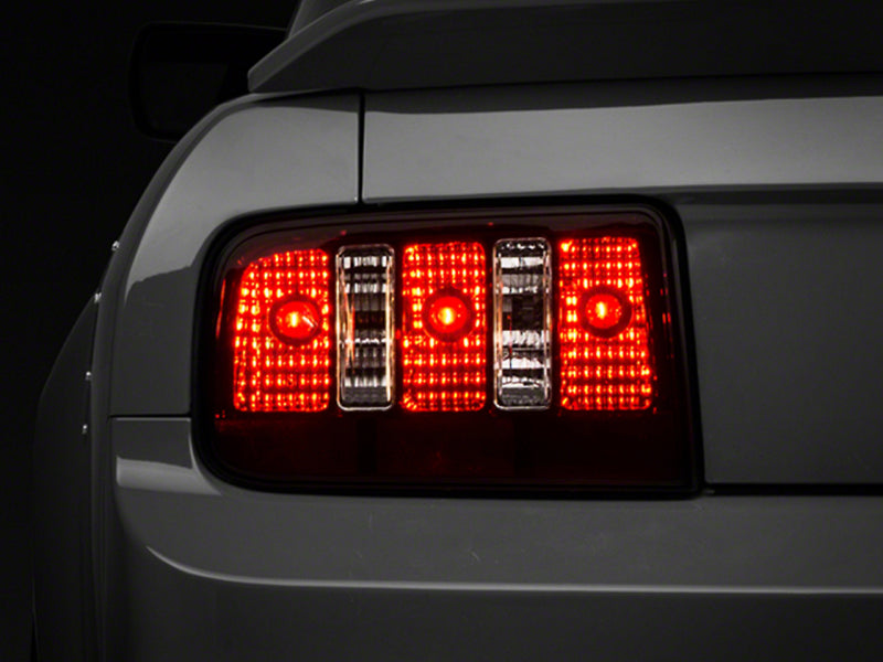 Raxiom Raxiom 05-09 Ford Mustang Coyote Tail Lights- Black Housing (Smoked Lens)