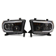 Load image into Gallery viewer, Raxiom 07-13 Toyota Tundra Axial Series Headlights w/ LED Bar- Black Housing (Clear Lens) - Raxiom TU16004