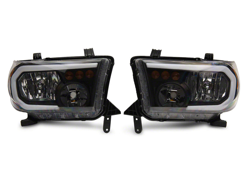 Raxiom Raxiom 07-13 Toyota Tundra Axial Series Headlights w/ LED Bar- Black Housing (Clear Lens)