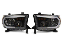 Load image into Gallery viewer, Raxiom Raxiom 07-13 Toyota Tundra Axial Series Headlights w/ LED Bar- Black Housing (Clear Lens)