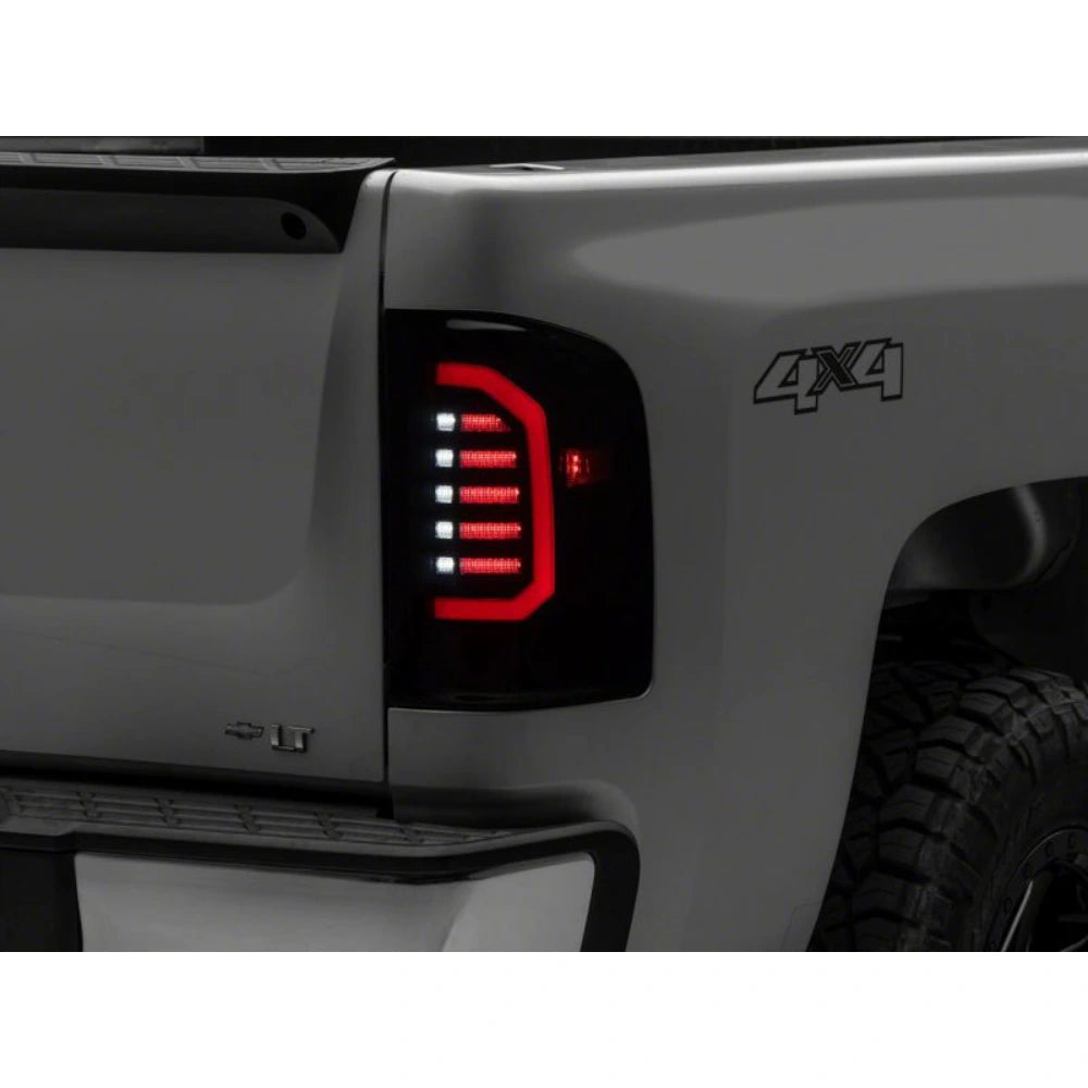 Raxiom 07-14 Chevrolet Silverado 1500 Axial Series LED Tail Lights- Black Housing (Smoked Lens) - Raxiom S150366
