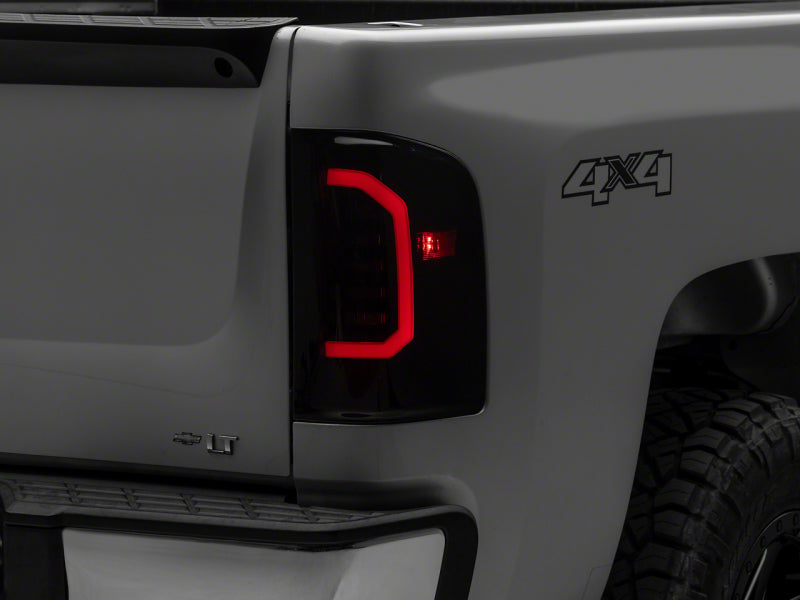 Raxiom Raxiom 07-14 Chevrolet Silverado 1500 Axial Series LED Tail Lights- Black Housing (Smoked Lens)