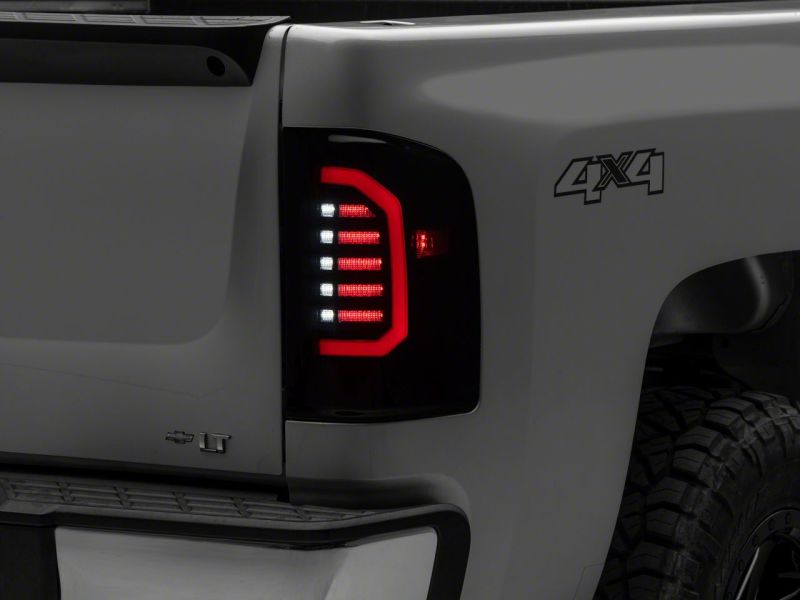 Raxiom Raxiom 07-14 Chevrolet Silverado 1500 Axial Series LED Tail Lights- Black Housing (Smoked Lens)