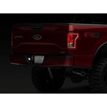Load image into Gallery viewer, Raxiom 07-14 Ford F-150 Axial Series LED License Plate Lamps- Smoked - Raxiom T549999