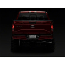 Load image into Gallery viewer, Raxiom 07-14 Ford F-150 Axial Series LED License Plate Lamps- Smoked - Raxiom T549999