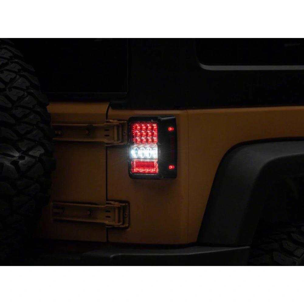 Raxiom 07-18 Jeep Wrangler JK Axial Series Lux LED Tail Lights- Black Housing (Clear Lens) - Raxiom J141596