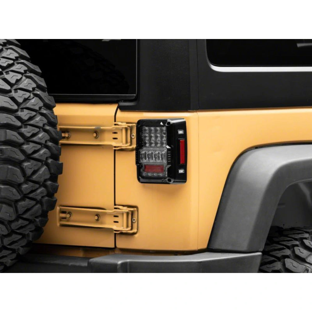 Raxiom 07-18 Jeep Wrangler JK Axial Series Lux LED Tail Lights- Black Housing (Clear Lens) - Raxiom J141596