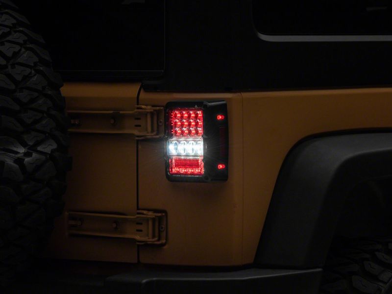 Raxiom Raxiom 07-18 Jeep Wrangler JK Axial Series Lux LED Tail Lights- Black Housing (Clear Lens)