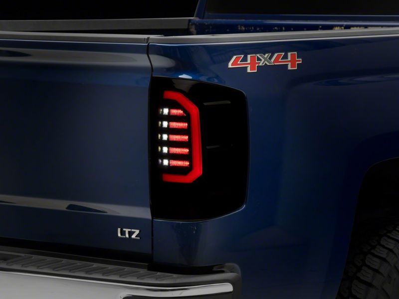 Raxiom Raxiom 14-18 Chevrolet Silverado 1500 Axial Series LED Tail Lights- Black Housing (Smoked Lens)