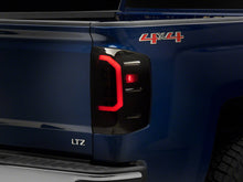 Load image into Gallery viewer, Raxiom Raxiom 14-18 Chevrolet Silverado 1500 Axial Series LED Tail Lights- Black Housing (Smoked Lens)