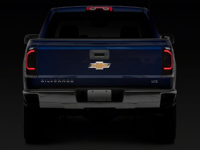 Raxiom Raxiom 14-18 Chevrolet Silverado 1500 Axial Series LED Tail Lights- Black Housing (Smoked Lens)