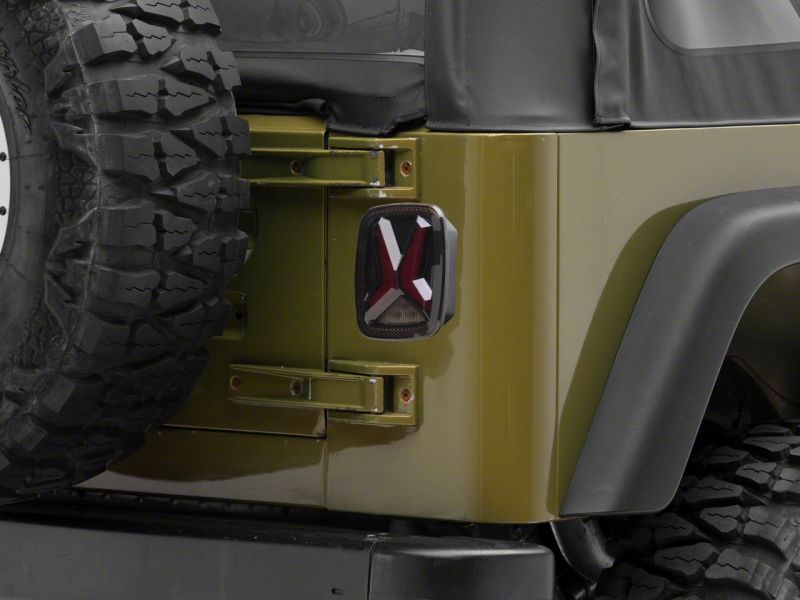 Raxiom Raxiom 76-06 Jeep CJ7 Wrangler YJ & TJ Gladiator LED Tail Lights- Black Housing (Smoked Lens)