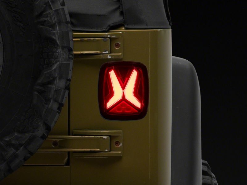 Raxiom Raxiom 76-06 Jeep CJ7 Wrangler YJ & TJ Gladiator LED Tail Lights- Black Housing (Smoked Lens)