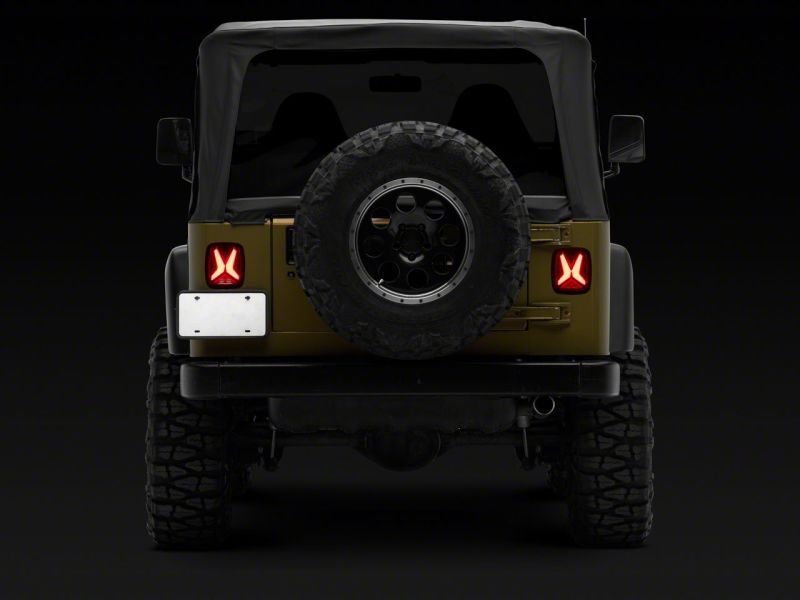 Raxiom Raxiom 76-06 Jeep CJ7 Wrangler YJ & TJ Gladiator LED Tail Lights- Black Housing (Smoked Lens)