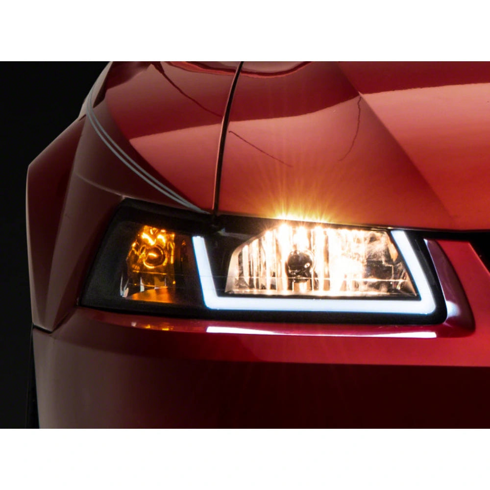 Raxiom 99-04 Ford Mustang Axial Series Headlights w/ LED Bar- Black Housing (Clear Lens) - Raxiom 422712