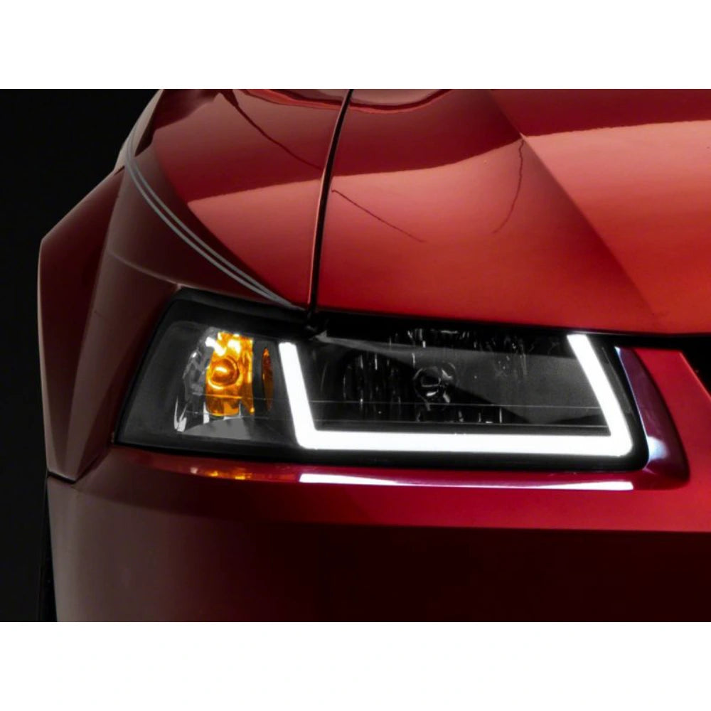 Raxiom 99-04 Ford Mustang Axial Series Headlights w/ LED Bar- Black Housing (Clear Lens) - Raxiom 422712