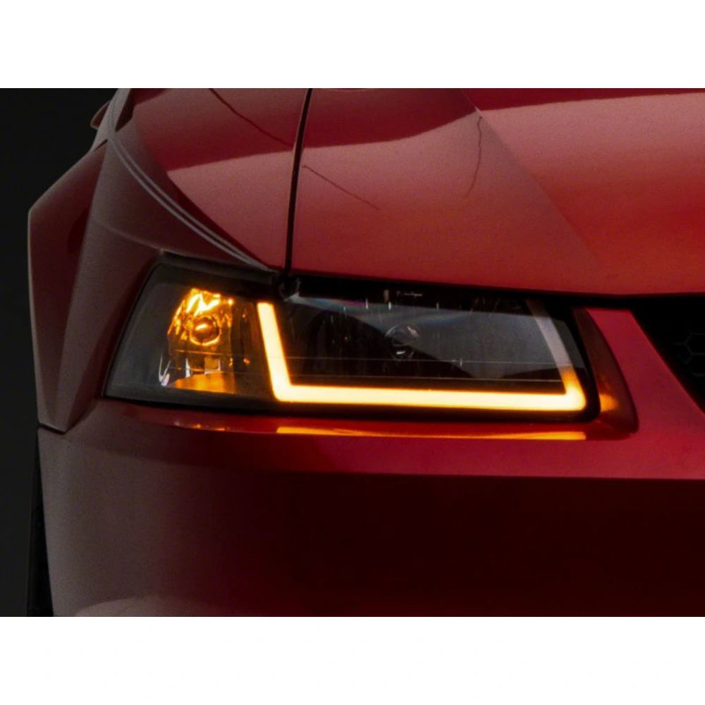 Raxiom 99-04 Ford Mustang Axial Series Headlights w/ Sequential LED Bar- Black Housing (Clear Lens) - Raxiom 422713