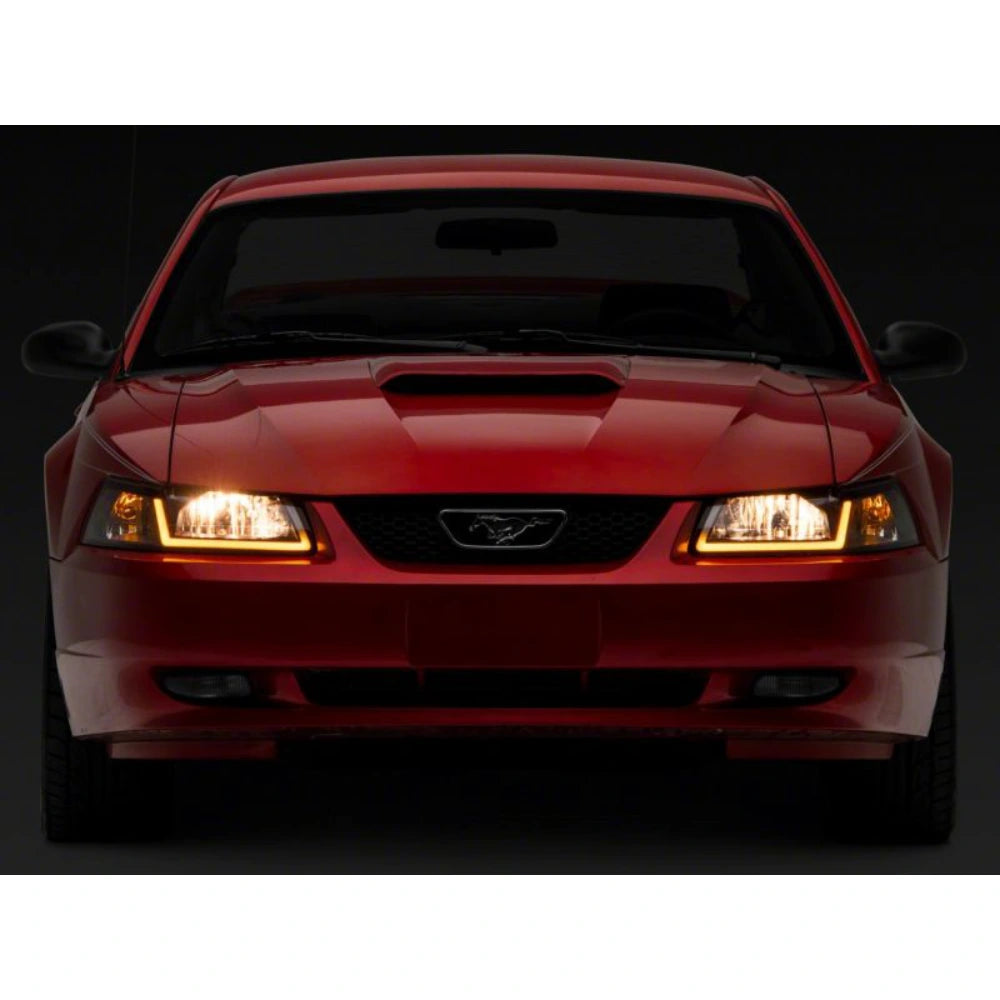Raxiom 99-04 Ford Mustang Axial Series Headlights w/ Sequential LED Bar- Black Housing (Clear Lens) - Raxiom 422713